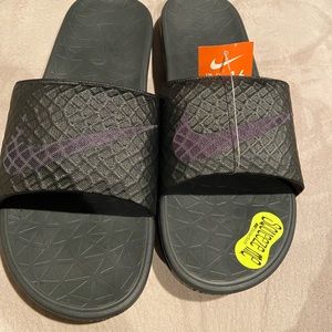 brand new Nike slides.